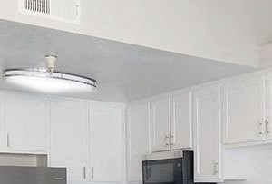 the retreat apartments l kitchen near hall with cupboards